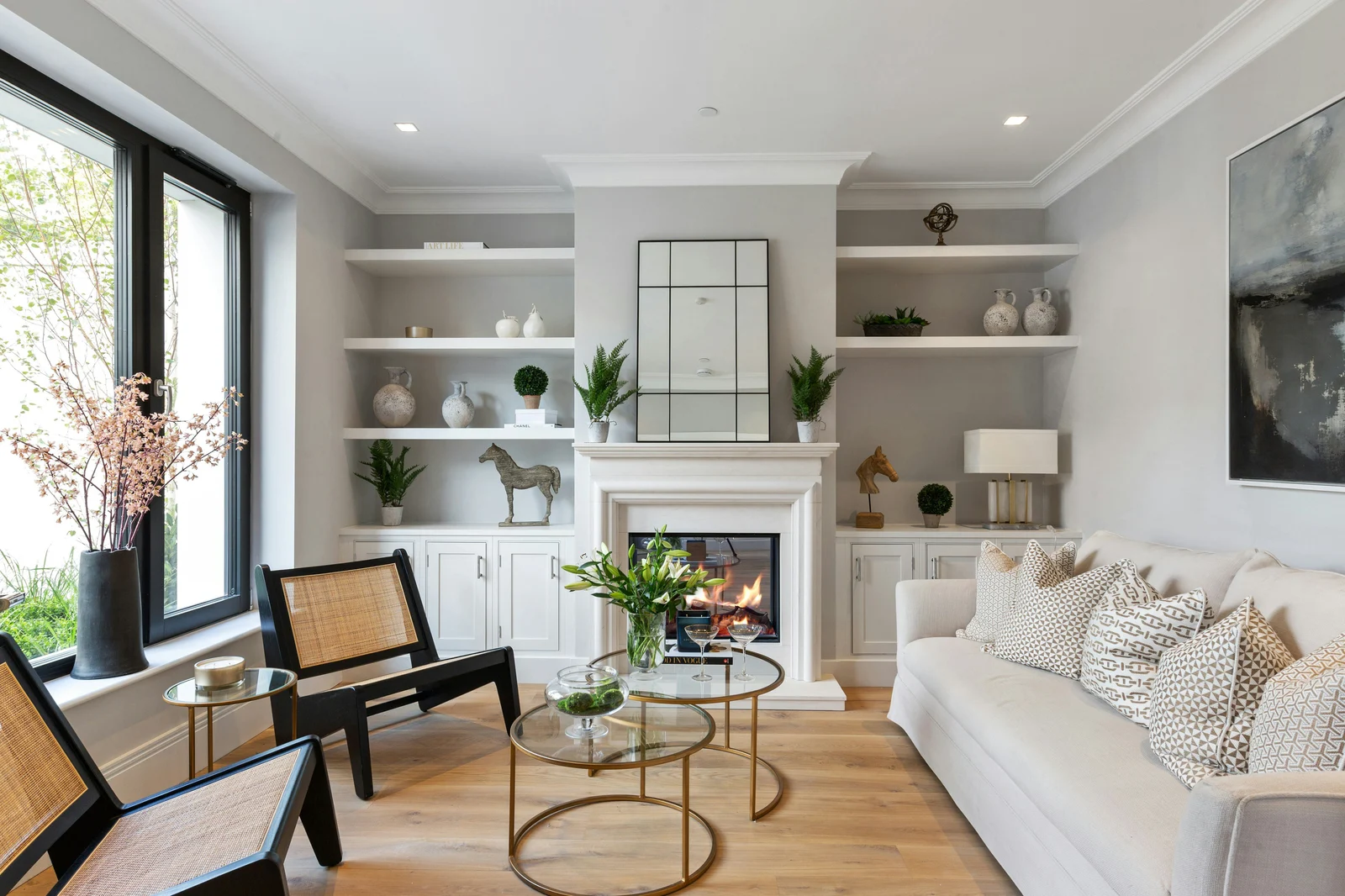Bright vacation rental room with layered lighting and warm color scheme